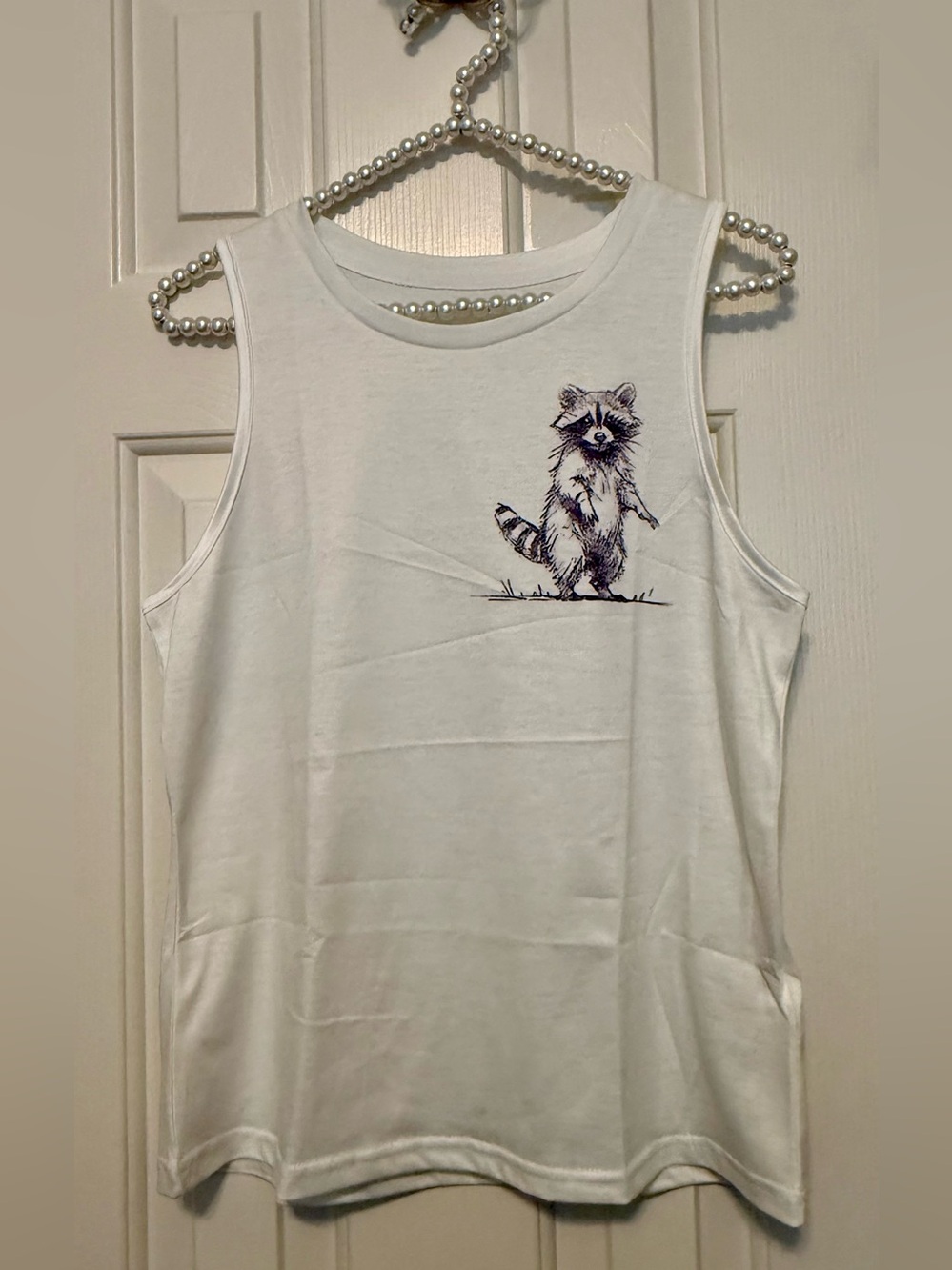 Tank top - size medium - off white w/small raccoon. Brand new - no tags- Perfect